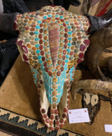 Bull bison skull with hand-knapped arrowhead