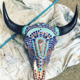 Bull bison skull with hand-knapped arrowhead center stone