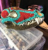 Coyote skull with a Picasso jasper forehead stone