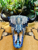 Bull bison skull with hand-knapped arrowhead and antique buffalo nickels