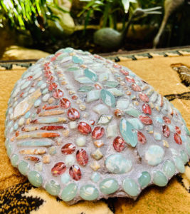 Turtle shell is primarily Amazon oye, sea sediment jasper, chalcedony, and cherry quartz. 11 x 9 1/2 inches