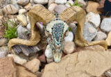 Sheep with green obsidian knapped arrowhead